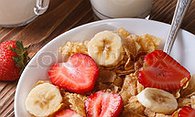 Frosted Flakes with some fruit up in the bowl